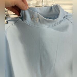 Under Armour‎ women’s baby blue form fitting turtleneck base layer. Size L